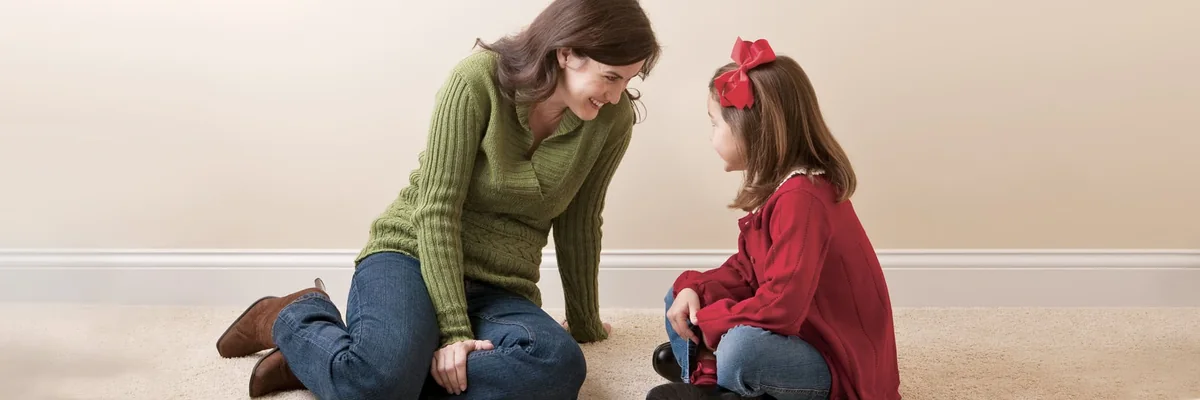 Parent and child relaxing in a comfortable home