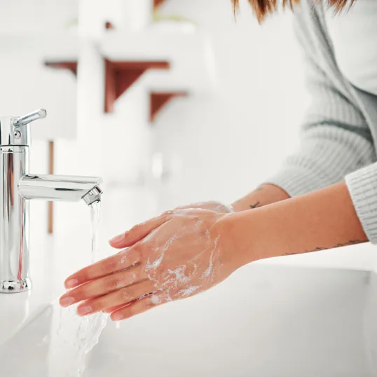 Hot water running at a bathroom sink