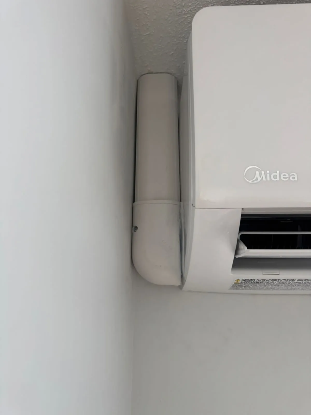 Close-up of a Midea ductless head and its tidy line cover