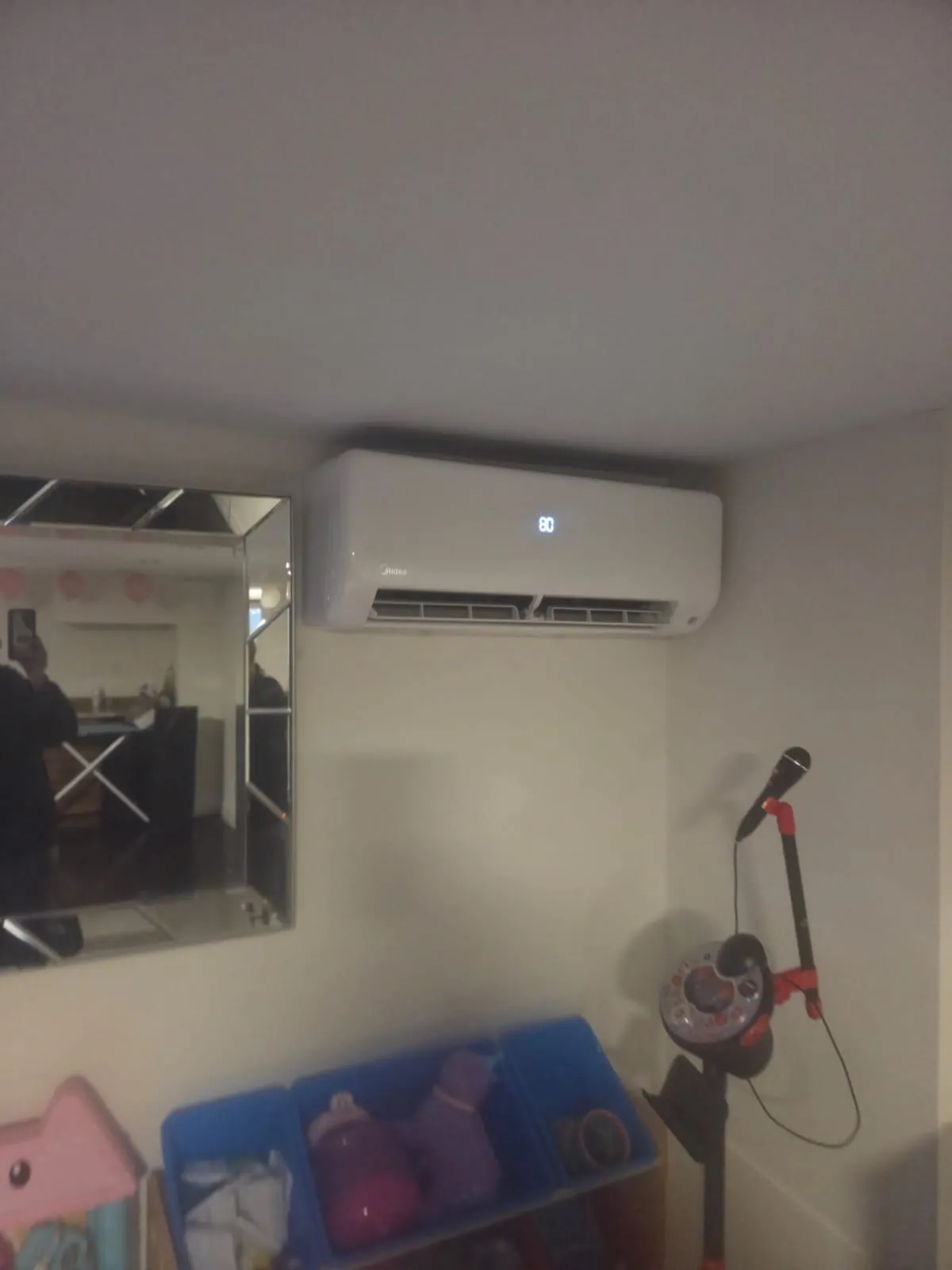 Ductless wall unit above a mirrored wall