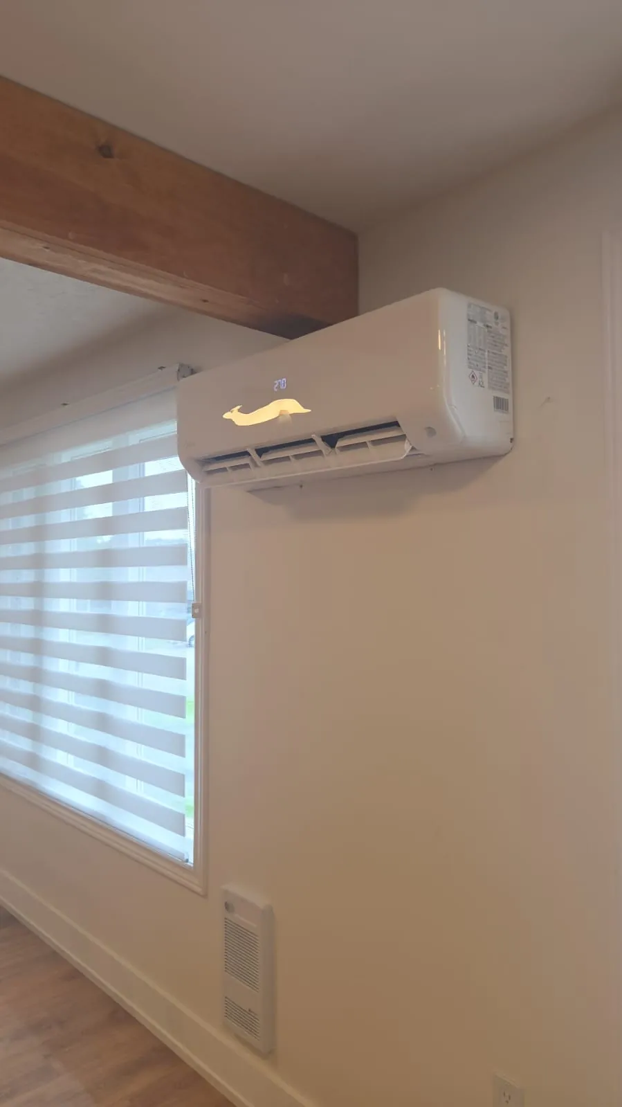 Ductless wall unit above a sunny window