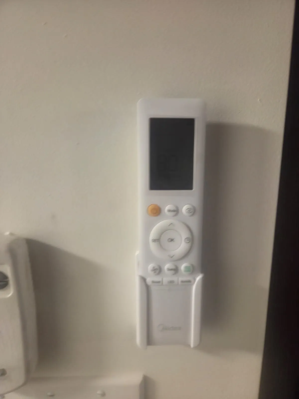 Ductless remote in its wall holder