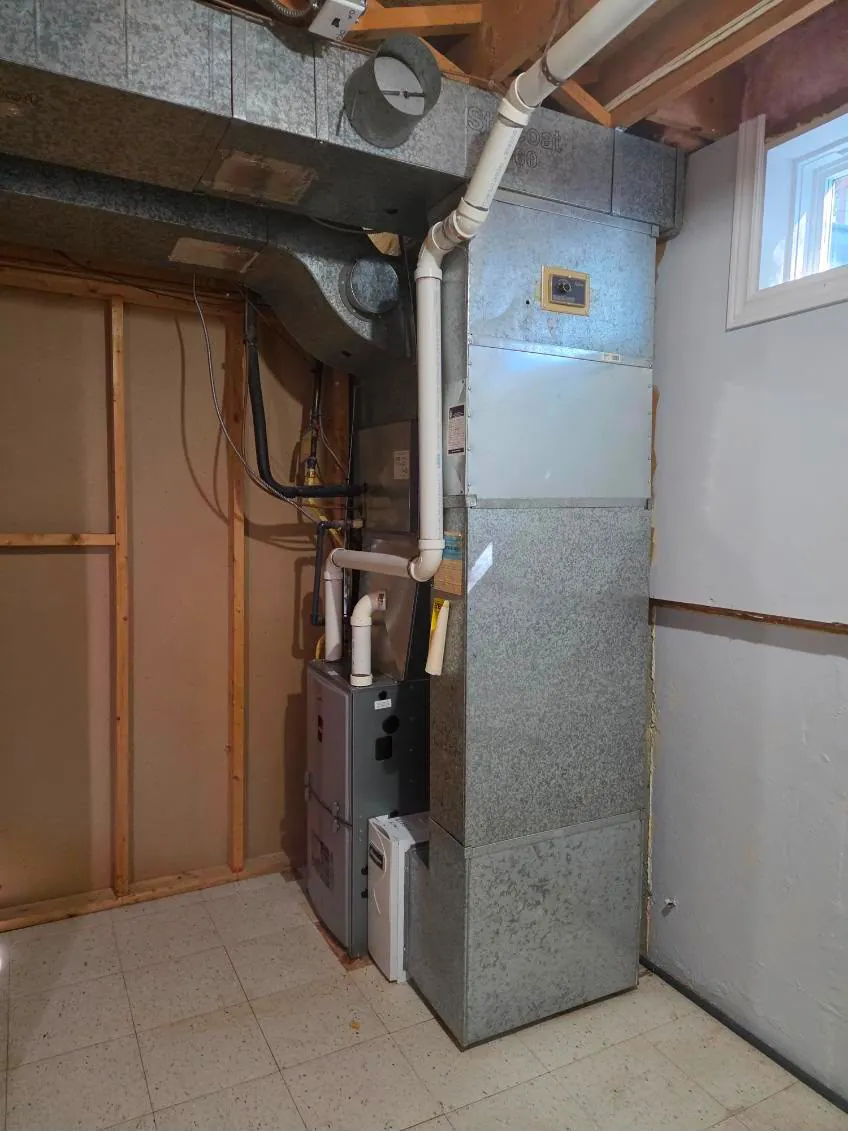 Furnace with matched coil and supply plenum in a utility room