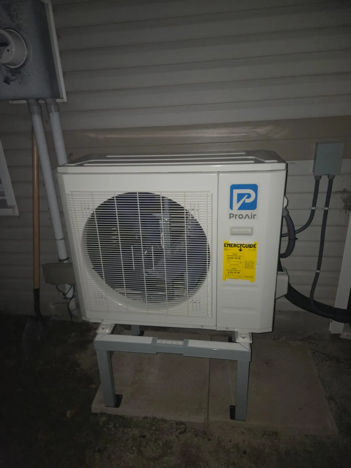 Outdoor heat pump beside the hydro meter and disconnect