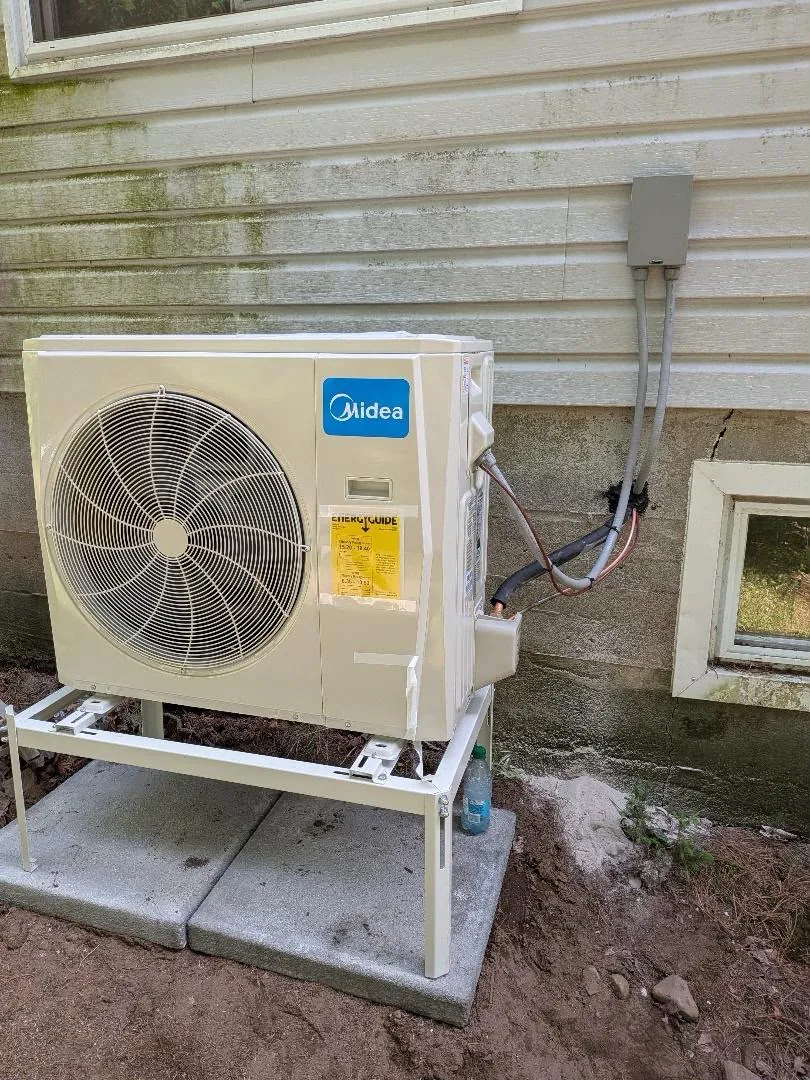 Midea ductless outdoor unit with tidy line set and disconnect