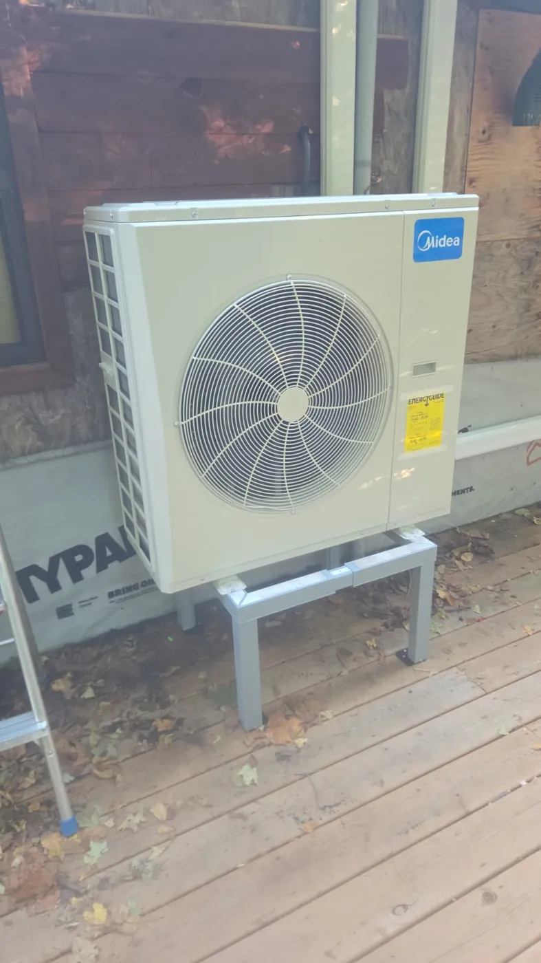 Midea outdoor unit on a stand on a wooden deck