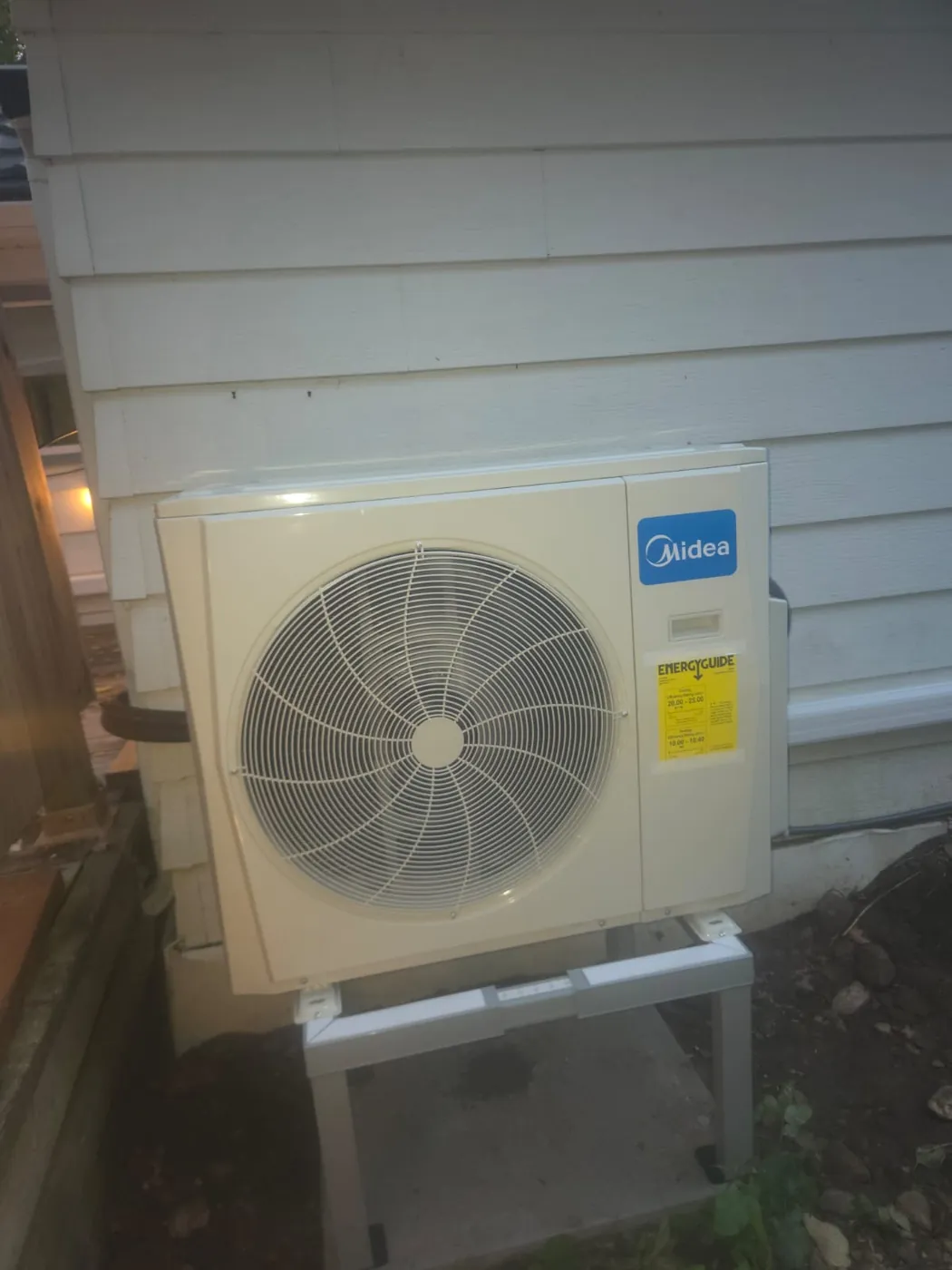 Midea outdoor unit installed on a level stand