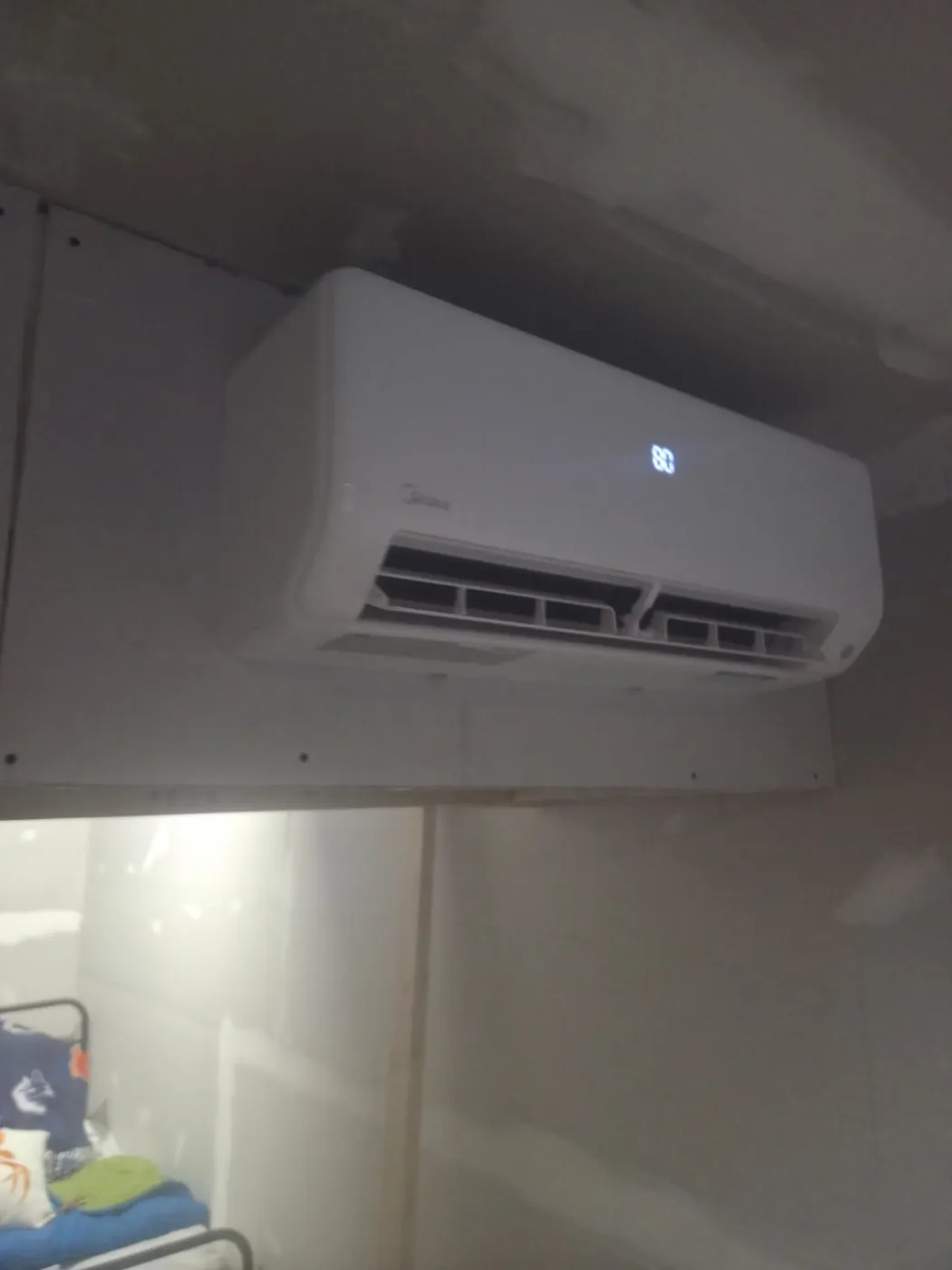 Midea ductless head heating and cooling a basement room