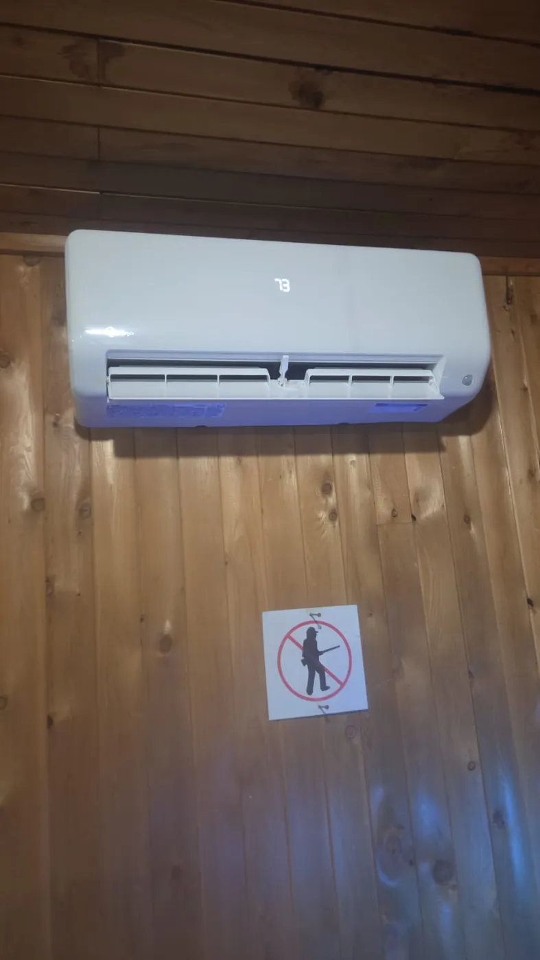 Midea ductless head on a cedar wall at a cottage