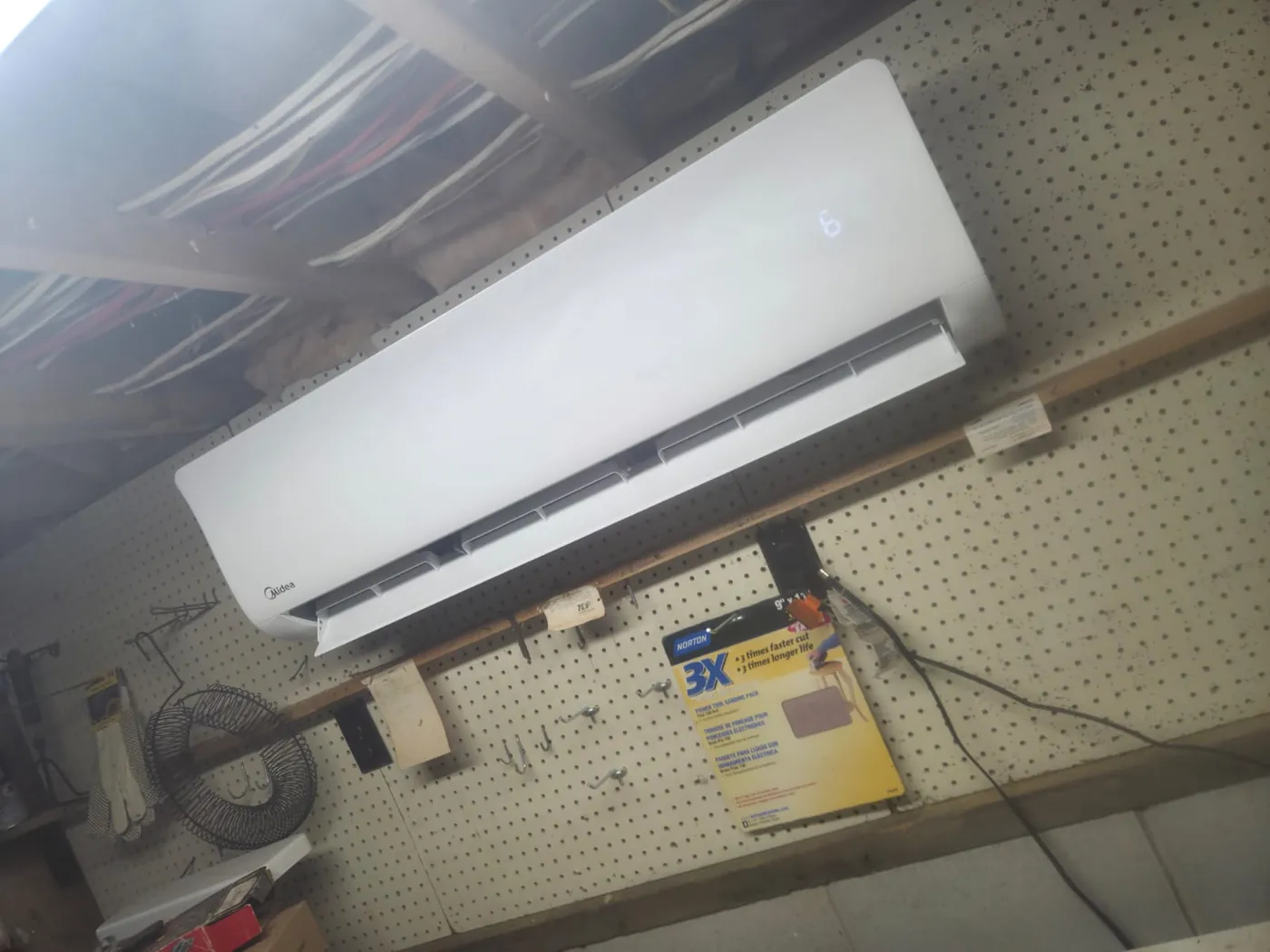 Midea ductless head heating and cooling a garage workshop